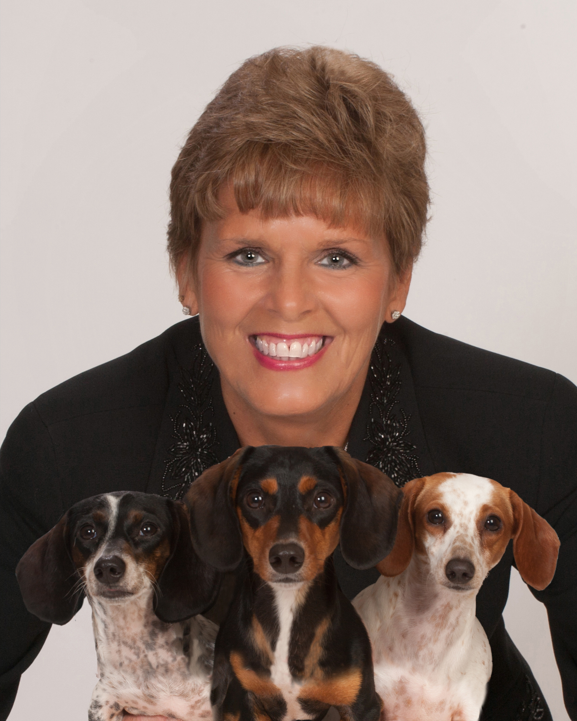 Melanie A. Costa with her three dachshunds